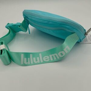 Lululemon 1L Everywhere Belt Bag Word Mark Baby Blue/Teal Strap white letters